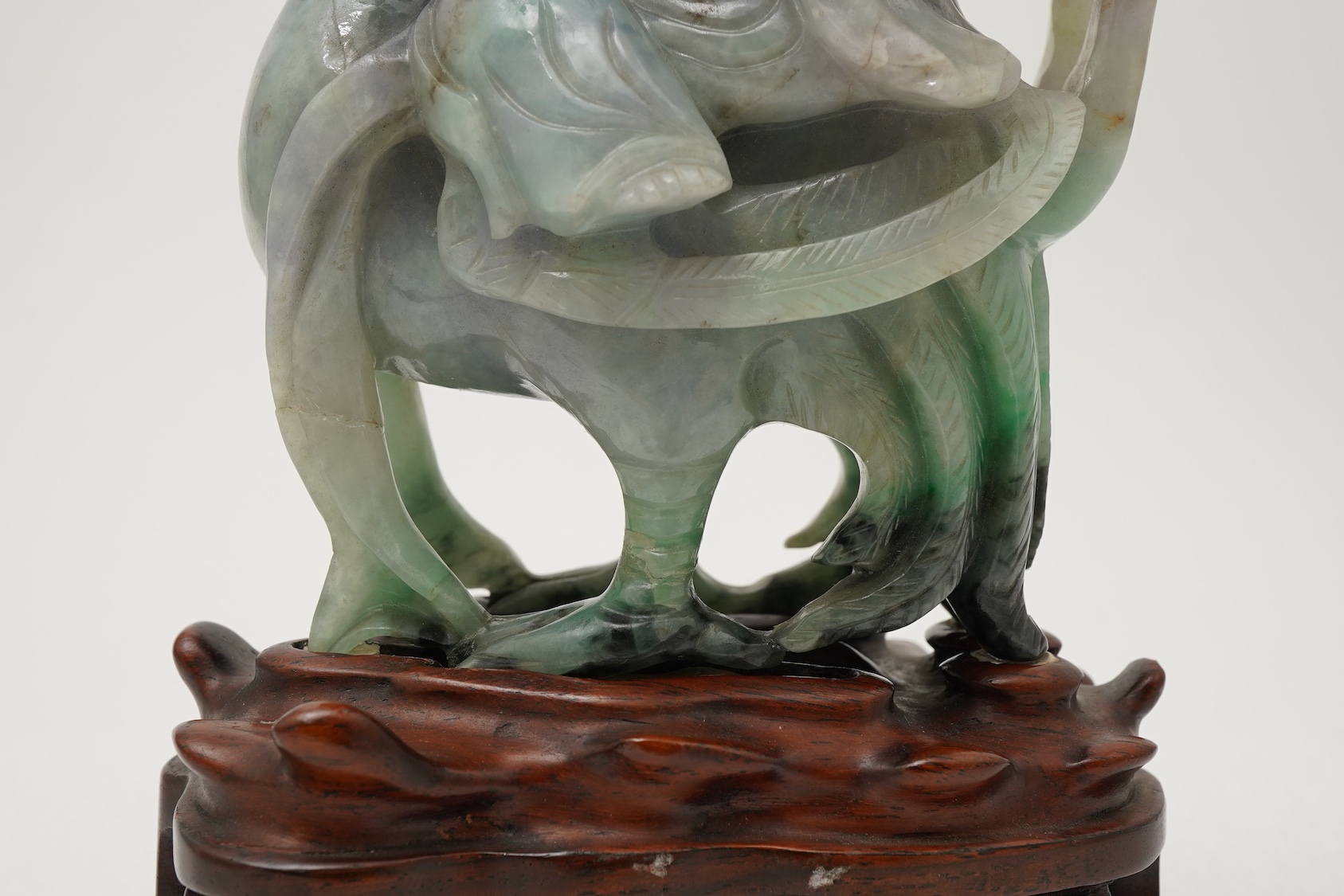 A Chinese jadeite figure of Xi Wangmu riding on a phoenix, late 19th/early 20th century